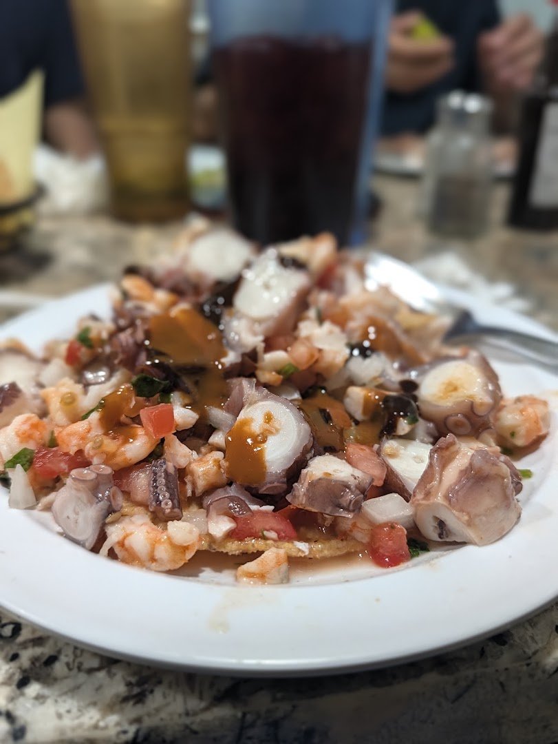 Seafood plates in a casual dining room.